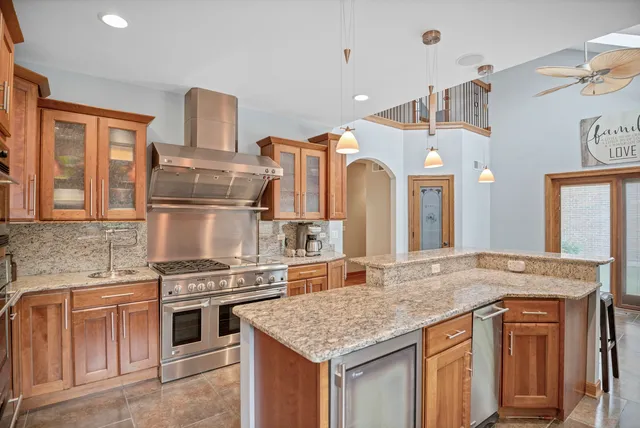 a bathroom with a sink a toilet a mirror and shower curtain