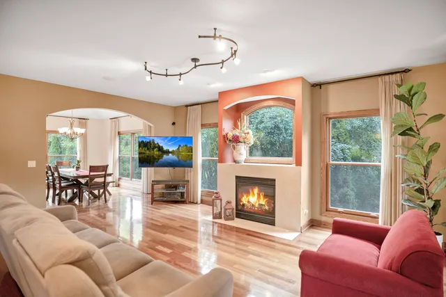 a view of a dining room with furniture and chandelier