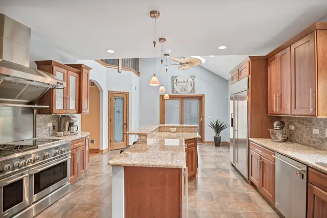 a view of living room with furniture and a clock