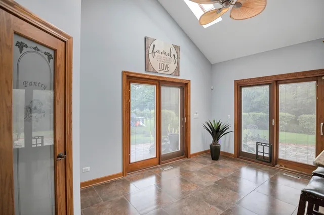 a living room with a bed furniture and a window