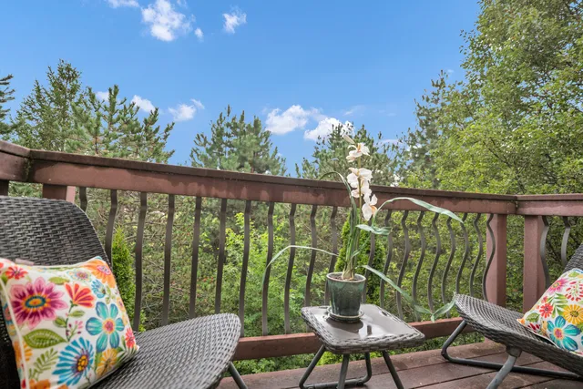 a bedroom with furniture and a large window