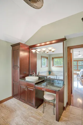 a bathroom with a toilet and shower