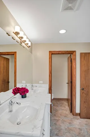 an aerial view of residential house with outdoor space and swimming pool