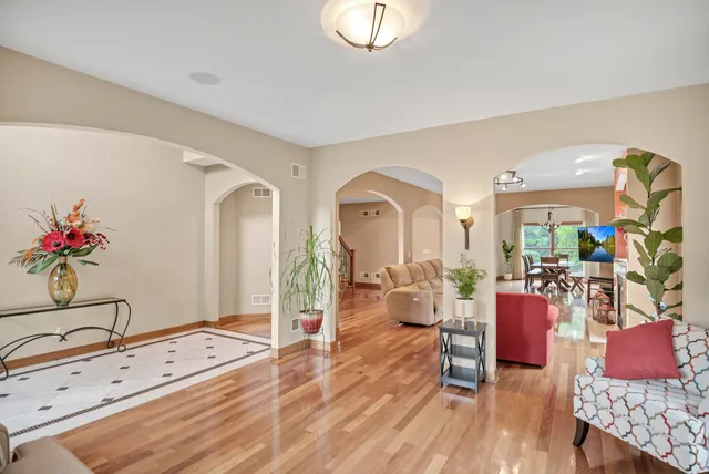a living room with furniture fireplace and flat screen tv