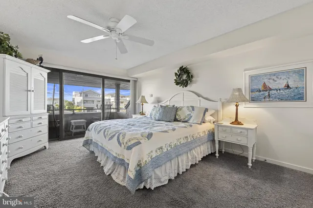 a spacious bedroom with a bed and a walk in closet