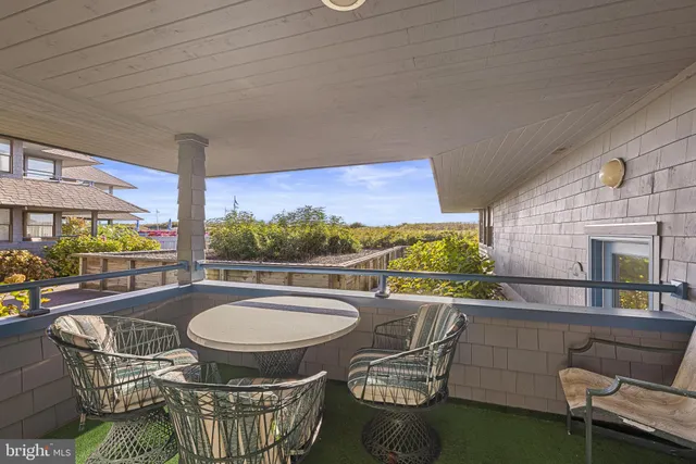a living room with furniture a rug and a fireplace