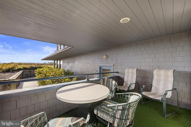 a view of a terrace with sitting area