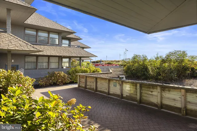 a view of a balcony with table and chairs