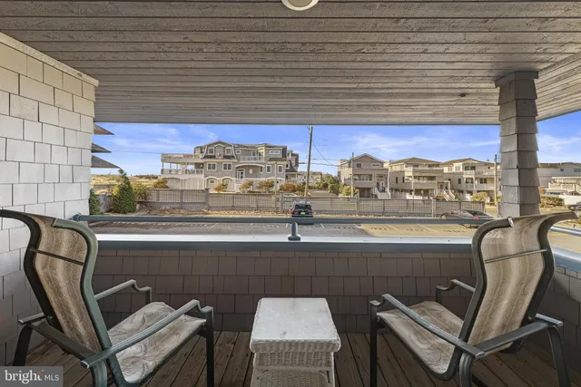 a view of a balcony with chairs