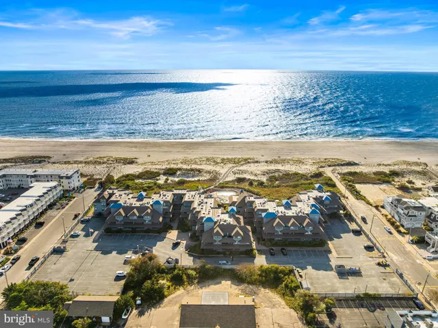 a front view of a house with a parking space