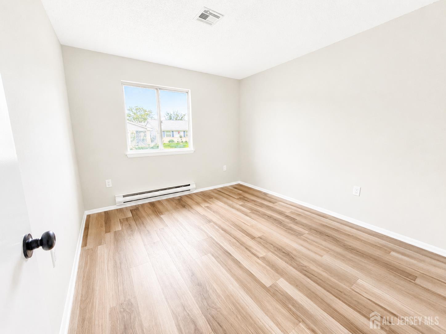 621 A Deal Road Monroe Township, NJ 08831 - Photo 21 of 27 an empty room with a window