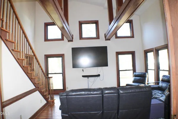 a view of workspace with furniture and wooden floor