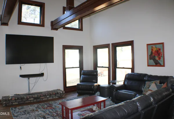 a bedroom with furniture and a window