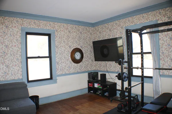 a bedroom with a bed and a night stand