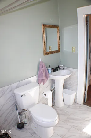 a bed sitting in a bedroom next to a building