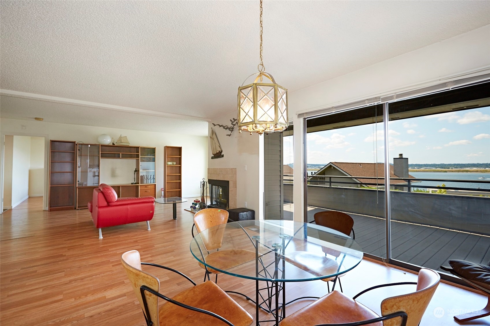 6902 Southeast Riverside Drive, Unit 4 Vancouver, WA 98664 - Photo 12 of 25 a dining room with furniture a chandelier and wooden floor