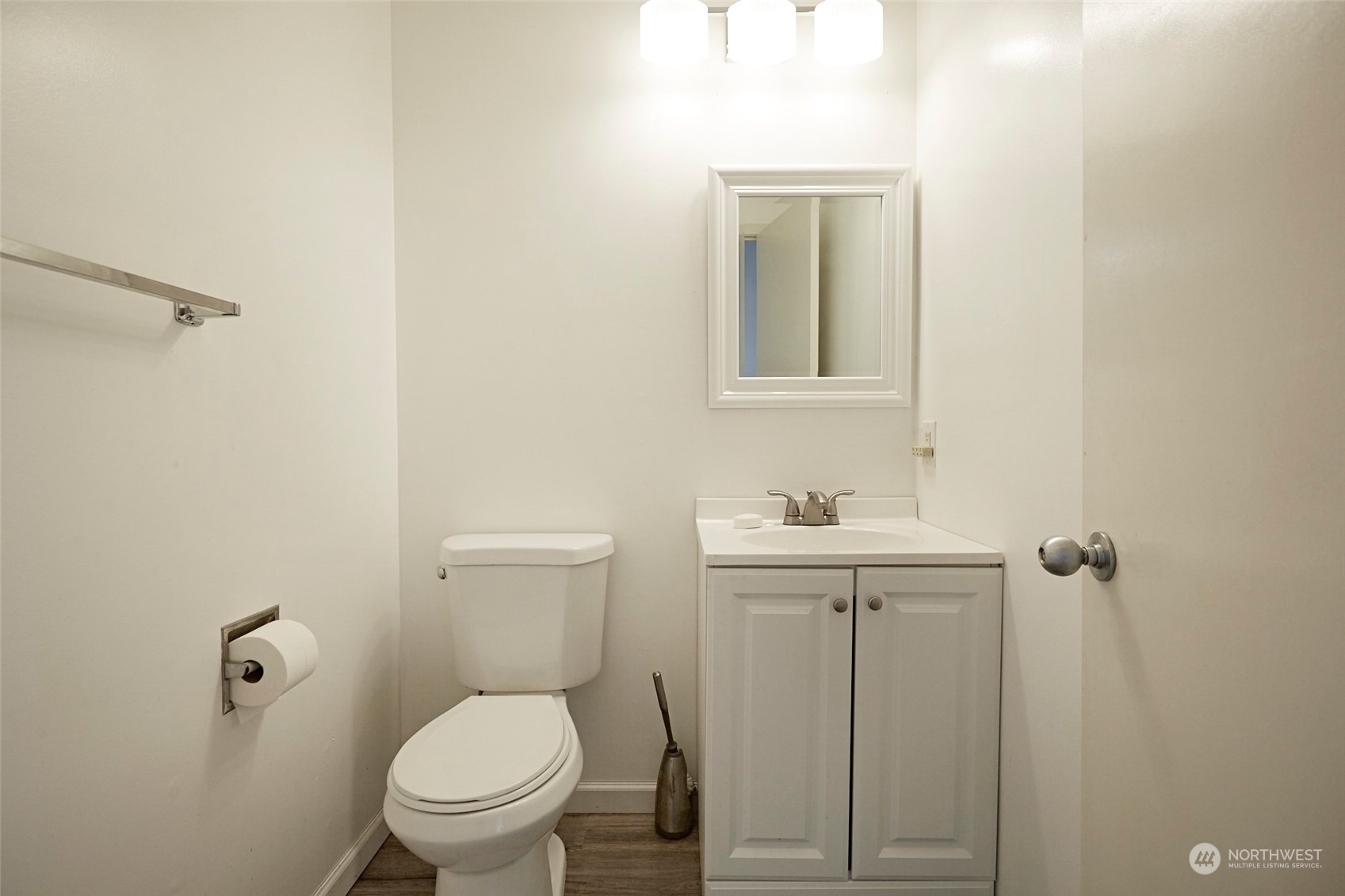 6902 Southeast Riverside Drive, Unit 4 Vancouver, WA 98664 - Photo 15 of 25 a bathroom with a toilet a sink and mirror