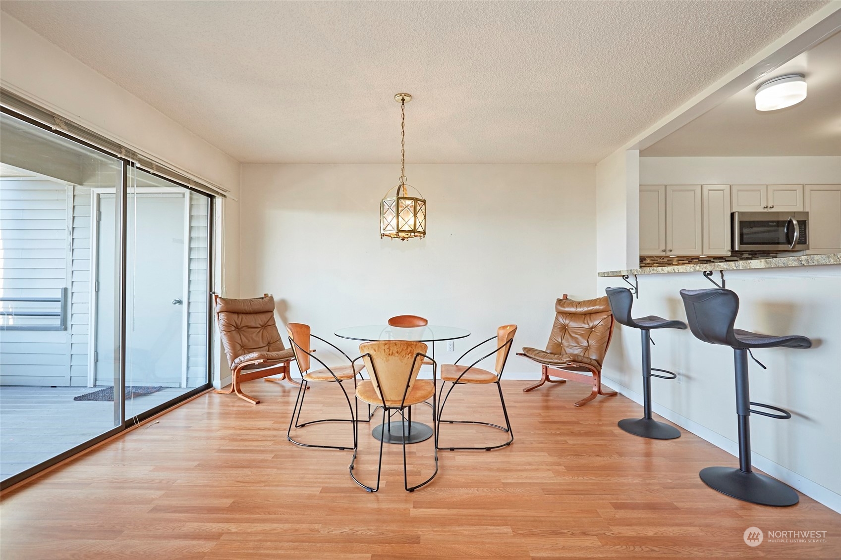 6902 Southeast Riverside Drive, Unit 4 Vancouver, WA 98664 - Photo 18 of 25 a view of a dining room with furniture and wooden floor