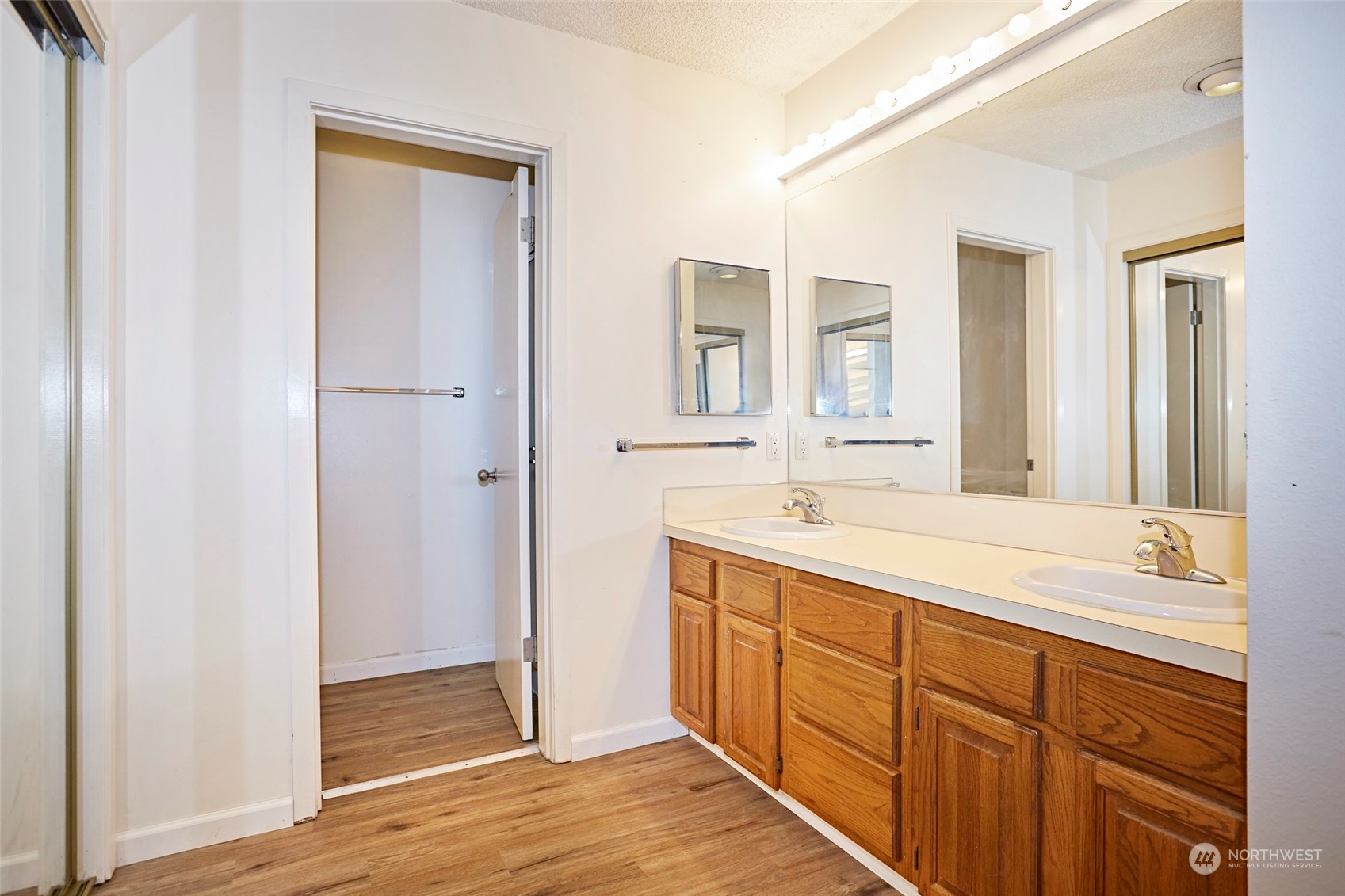 6902 Southeast Riverside Drive, Unit 4 Vancouver, WA 98664 - Photo 21 of 25 a spacious bathroom with a double vanity sink a mirror and a