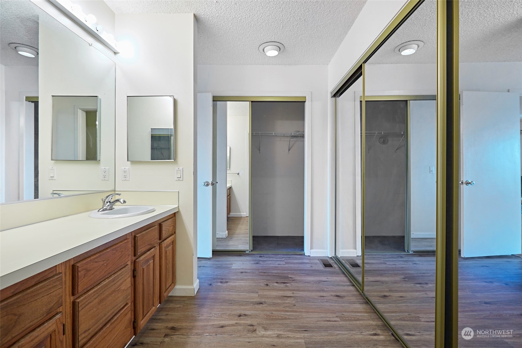 6902 Southeast Riverside Drive, Unit 4 Vancouver, WA 98664 - Photo 22 of 25 a bathroom with a sink and a mirror