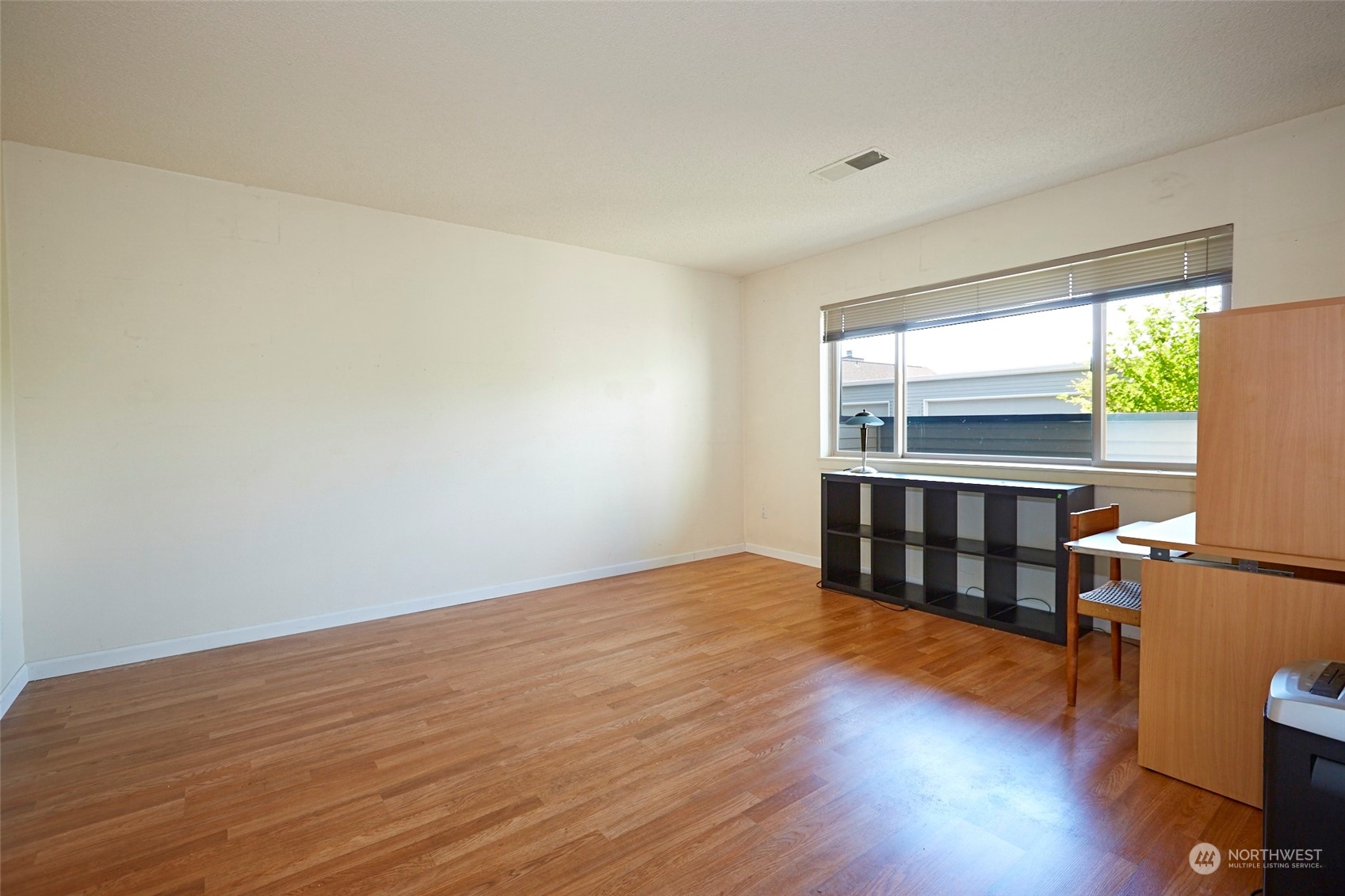 6902 Southeast Riverside Drive, Unit 4 Vancouver, WA 98664 - Photo 4 of 25 a view of a room with wooden floor and a window
