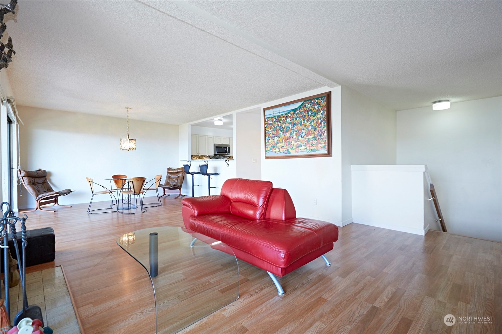 6902 Southeast Riverside Drive, Unit 4 Vancouver, WA 98664 - Photo 8 of 25 a living room with furniture a table and wooden floor