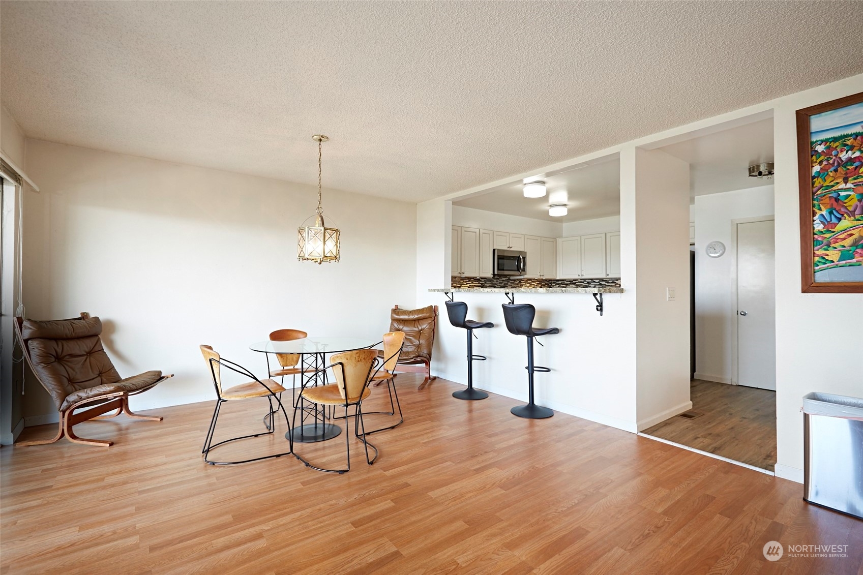 6902 Southeast Riverside Drive, Unit 4 Vancouver, WA 98664 - Photo 10 of 25 a view of a dining room with furniture and wooden floor