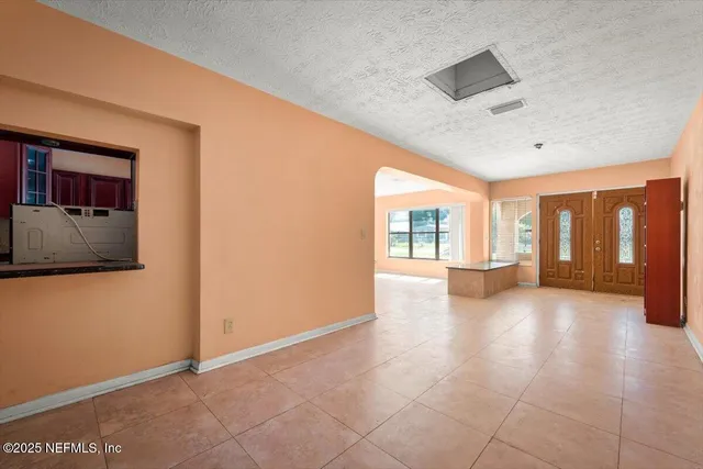 an aerial view of a house with a yard and garden