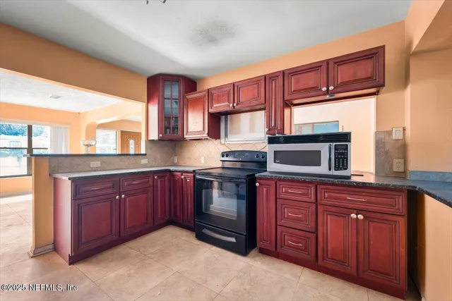 a front view of house with yard and outdoor seating
