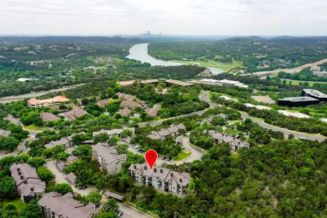 an aerial view of residential houses with city view and lake view