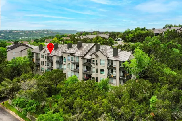 an aerial view of a house with a garden