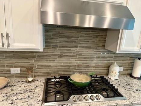 513 Forest Lane Canton, GA 30114 - Photo 23 of 78 a kitchen with a sink and a stove