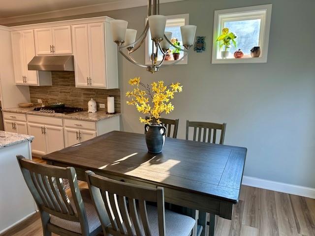 513 Forest Lane Canton, GA 30114 - Photo 26 of 78 a view of a dining room with furniture and wooden floor