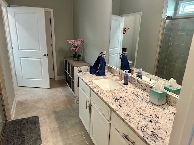 513 Forest Lane Canton, GA 30114 - Photo 30 of 78 a en suite bathroom with a granite countertop sink and a mirror