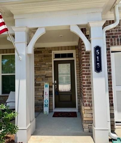 513 Forest Lane Canton, GA 30114 - Photo 4 of 78 a front view of a house with a door