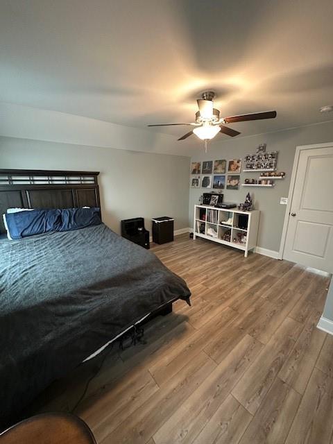 513 Forest Lane Canton, GA 30114 - Photo 50 of 78 a bedroom with a bed and a chandelier