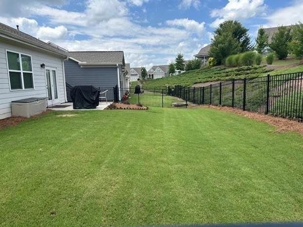 513 Forest Lane Canton, GA 30114 - Photo 53 of 78 a view of a house with backyard and porch