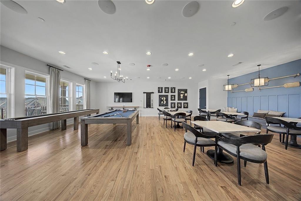 513 Forest Lane Canton, GA 30114 - Photo 71 of 78 a view of a dining area with furniture and wooden floor