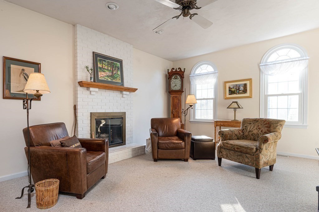 4 Camelot Circle Dudley, MA 01571 - Photo 12 of 42 a living room with furniture and a fireplace