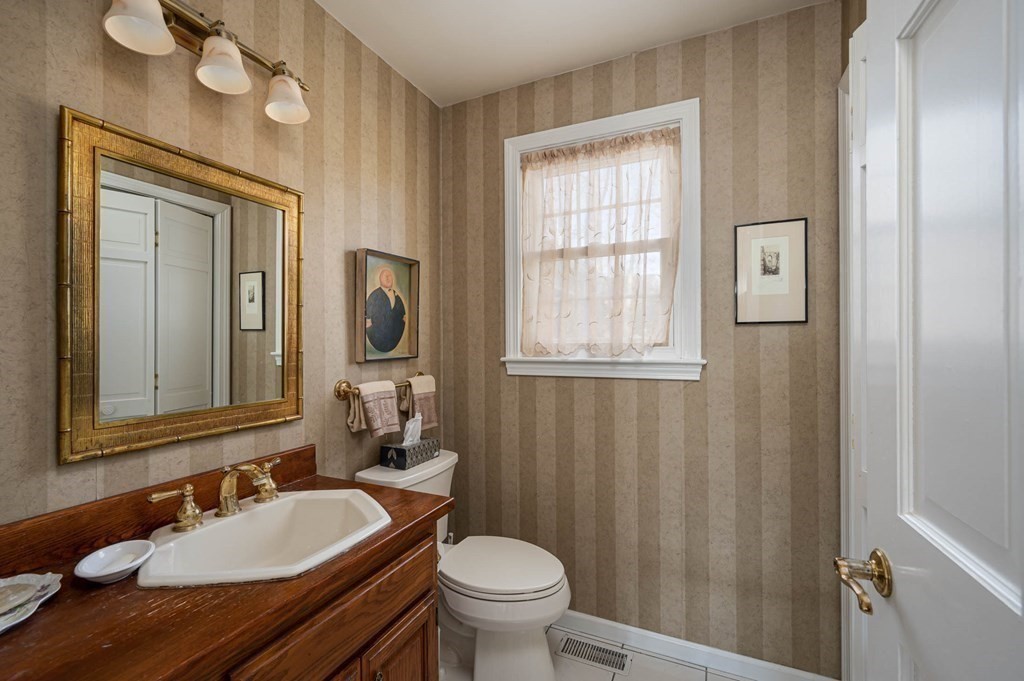 4 Camelot Circle Dudley, MA 01571 - Photo 23 of 42 a bathroom with a granite countertop sink toilet and mirror