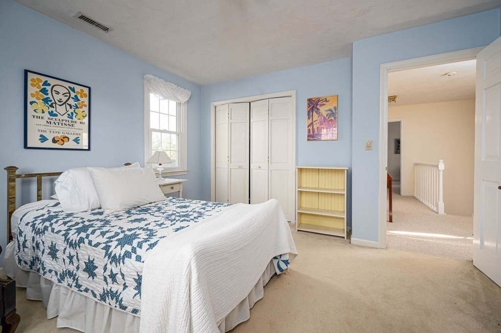 4 Camelot Circle Dudley, MA 01571 - Photo 25 of 42 a bedroom with a bed and a cabinets