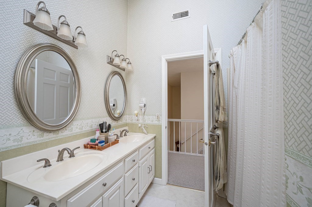 4 Camelot Circle Dudley, MA 01571 - Photo 33 of 42 a bathroom with a double vanity sink mirror and bathtub
