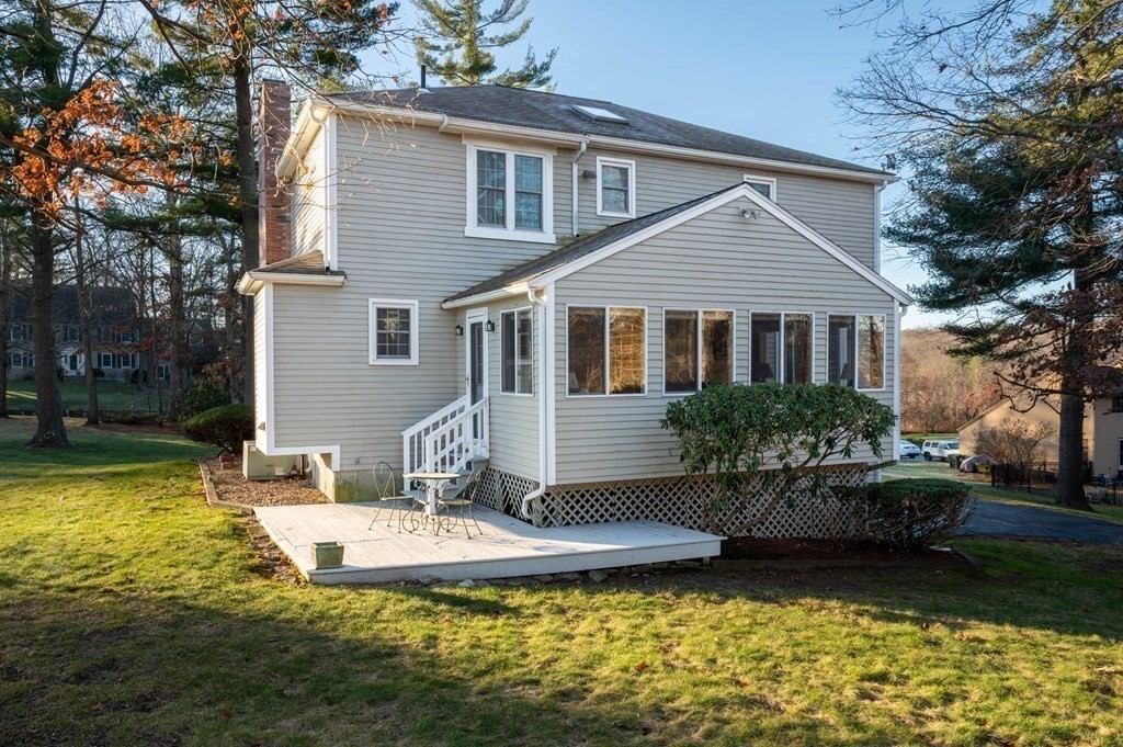 4 Camelot Circle Dudley, MA 01571 - Photo 6 of 42 a front view of a house with swimming pool and garden