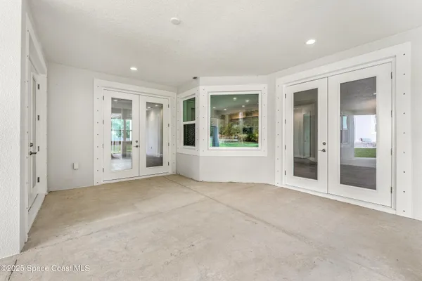 an empty room with windows