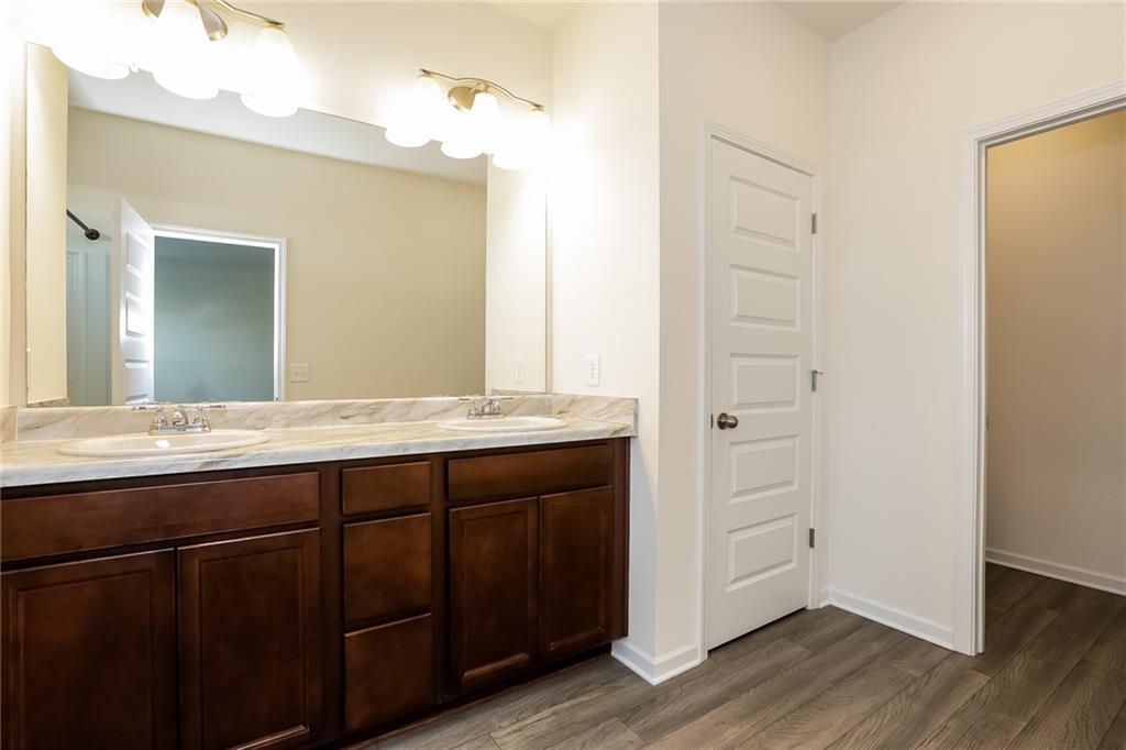 36 Felton Walk Boulevard Cartersville, GA 30120 - Photo 11 of 15 a bathroom with a granite countertop sink and a mirror