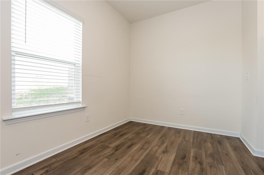 36 Felton Walk Boulevard Cartersville, GA 30120 - Photo 5 of 15 an empty room with wooden floor and windows