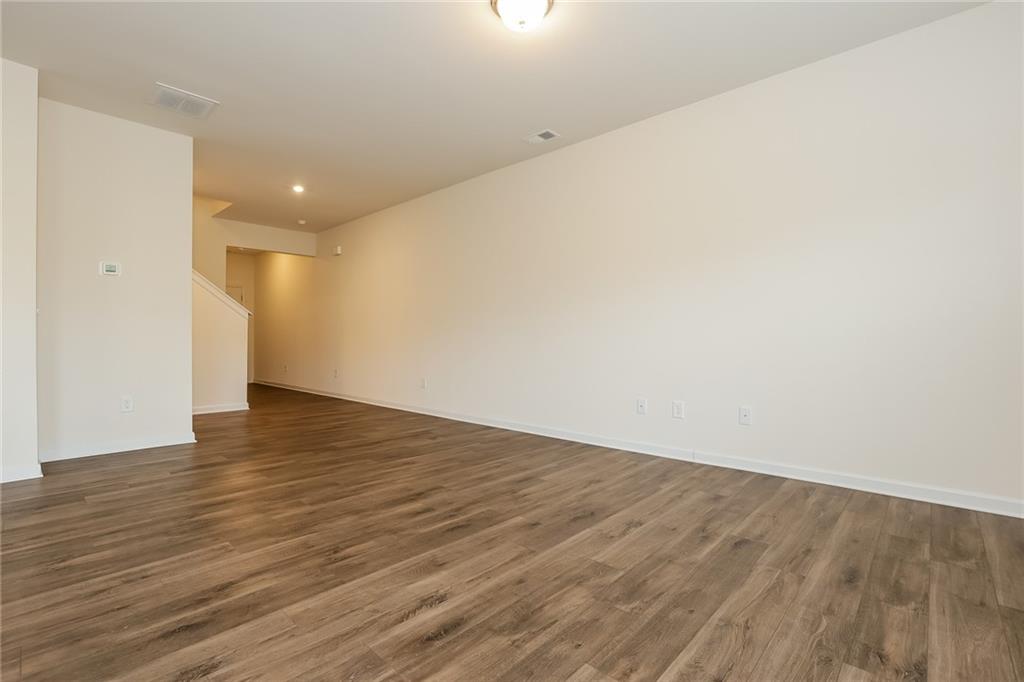 36 Felton Walk Boulevard Cartersville, GA 30120 - Photo 6 of 15 a view of an empty room with wooden floor