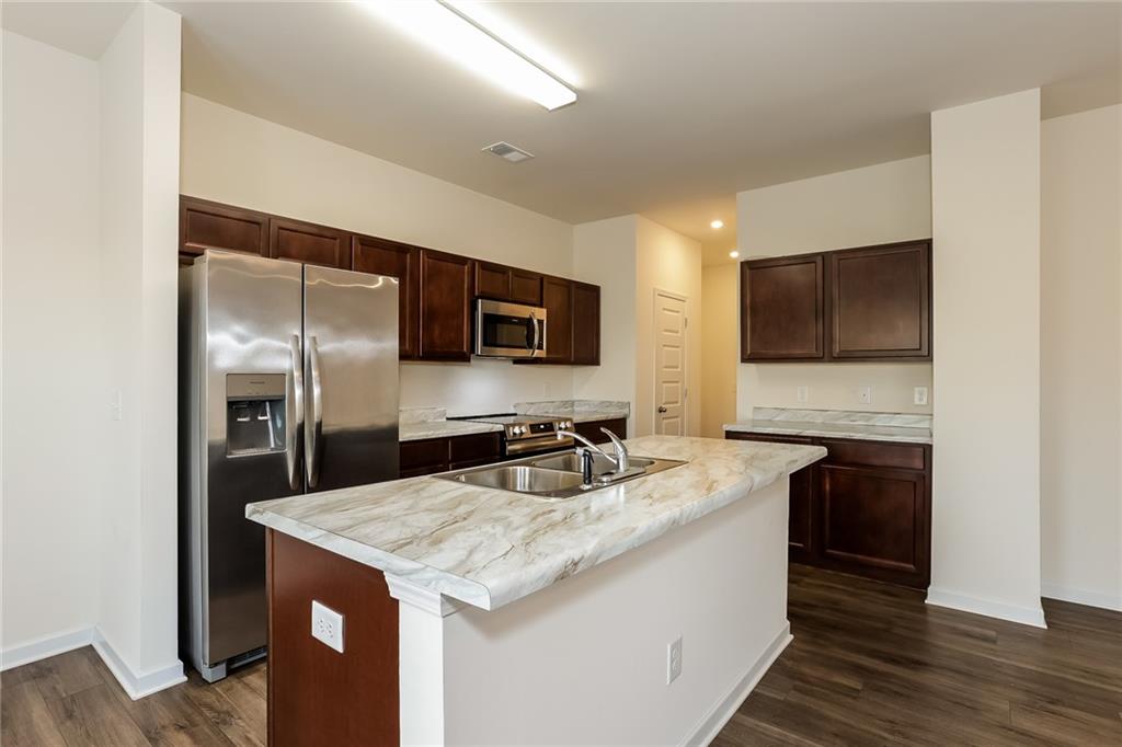 36 Felton Walk Boulevard Cartersville, GA 30120 - Photo 7 of 15 a kitchen with a sink microwave and refrigerator