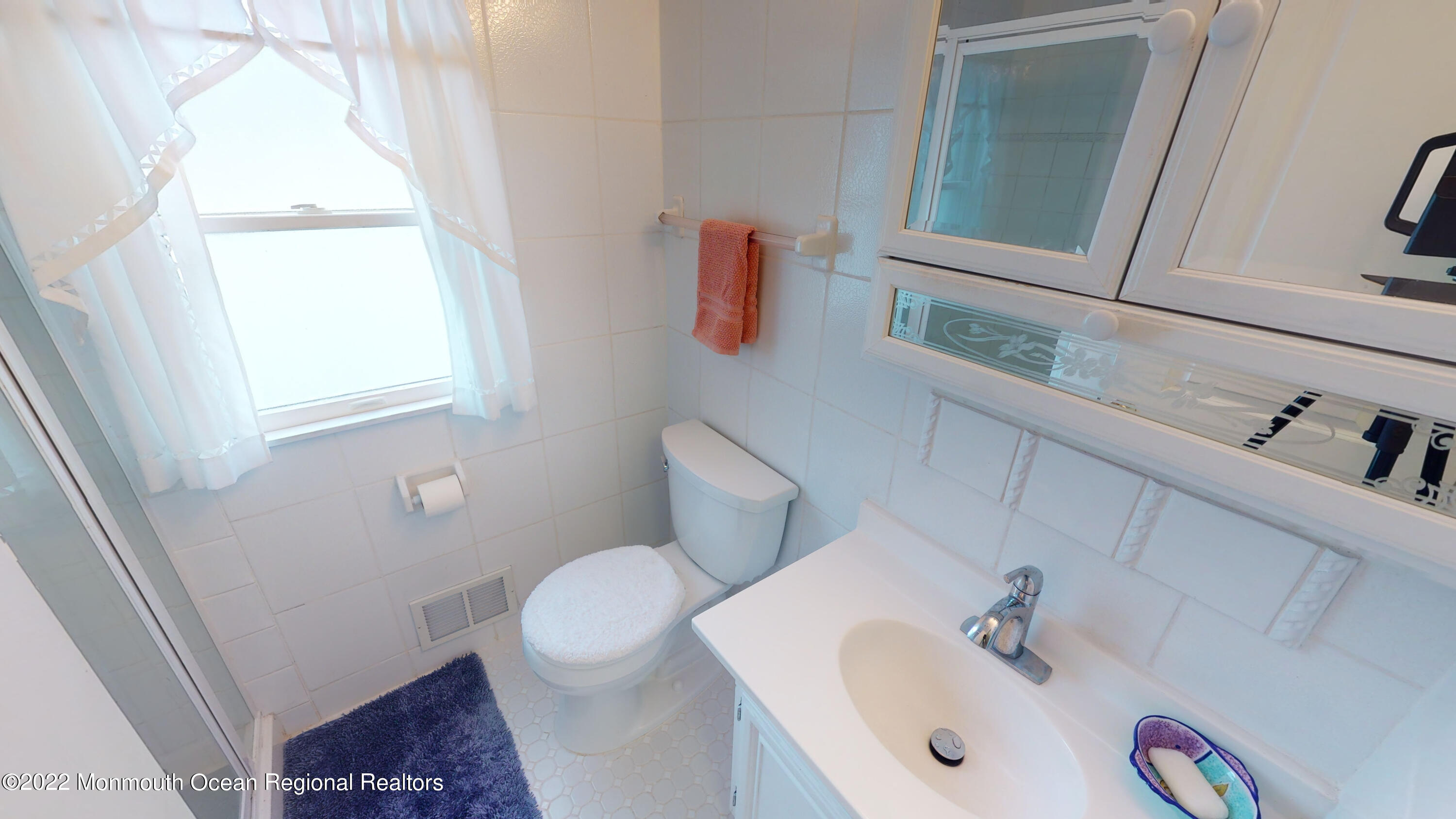 2 Funston Road Lavallette, NJ 08735 - Photo 15 of 24 a bathroom with a sink and a mirror