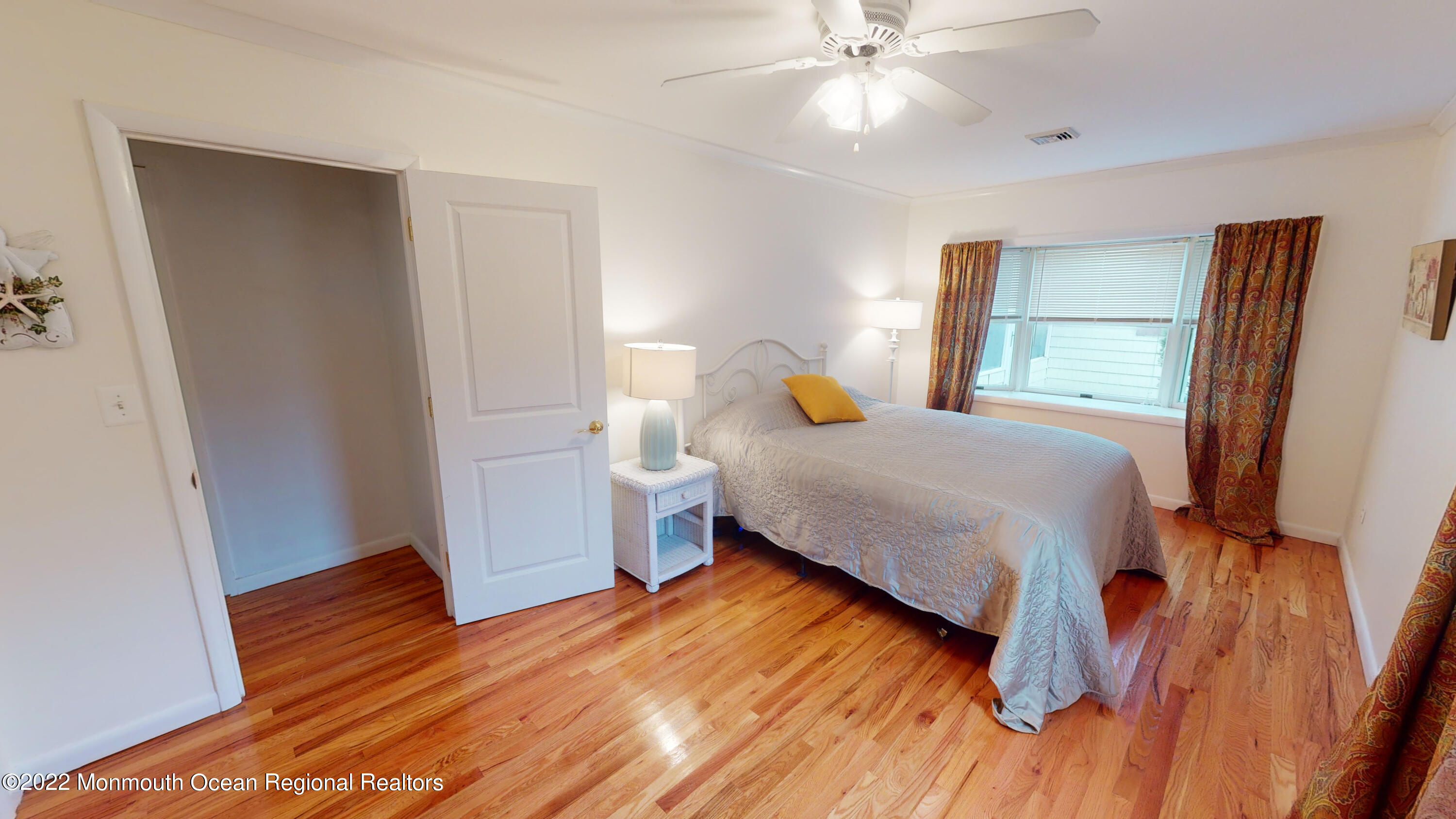 2 Funston Road Lavallette, NJ 08735 - Photo 16 of 24 a bedroom with a bed and a flat tv screen on dresser